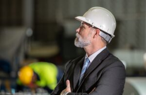real estate investor in hard hat giving direct oversight
